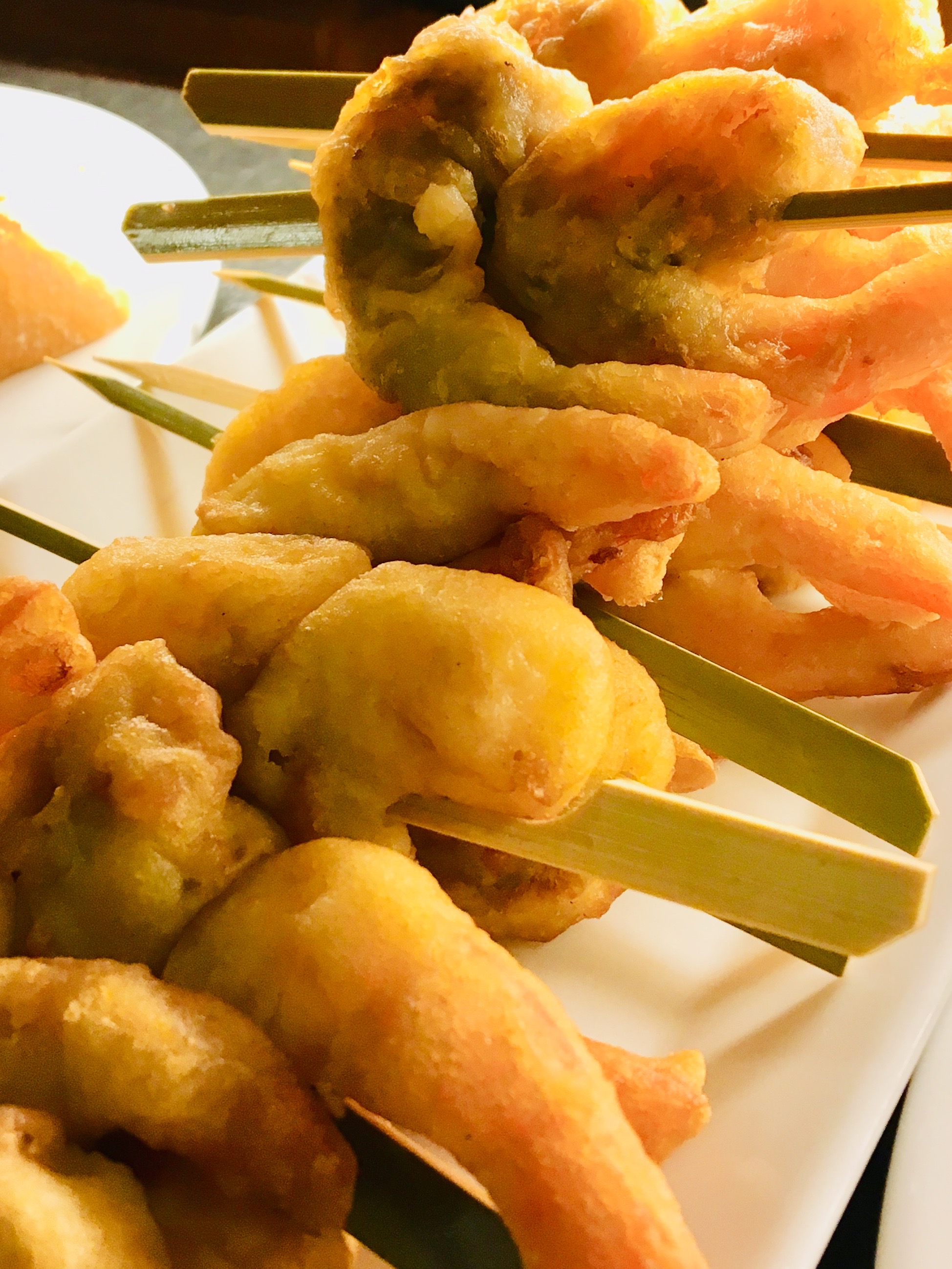 Tempura prawns on skewers