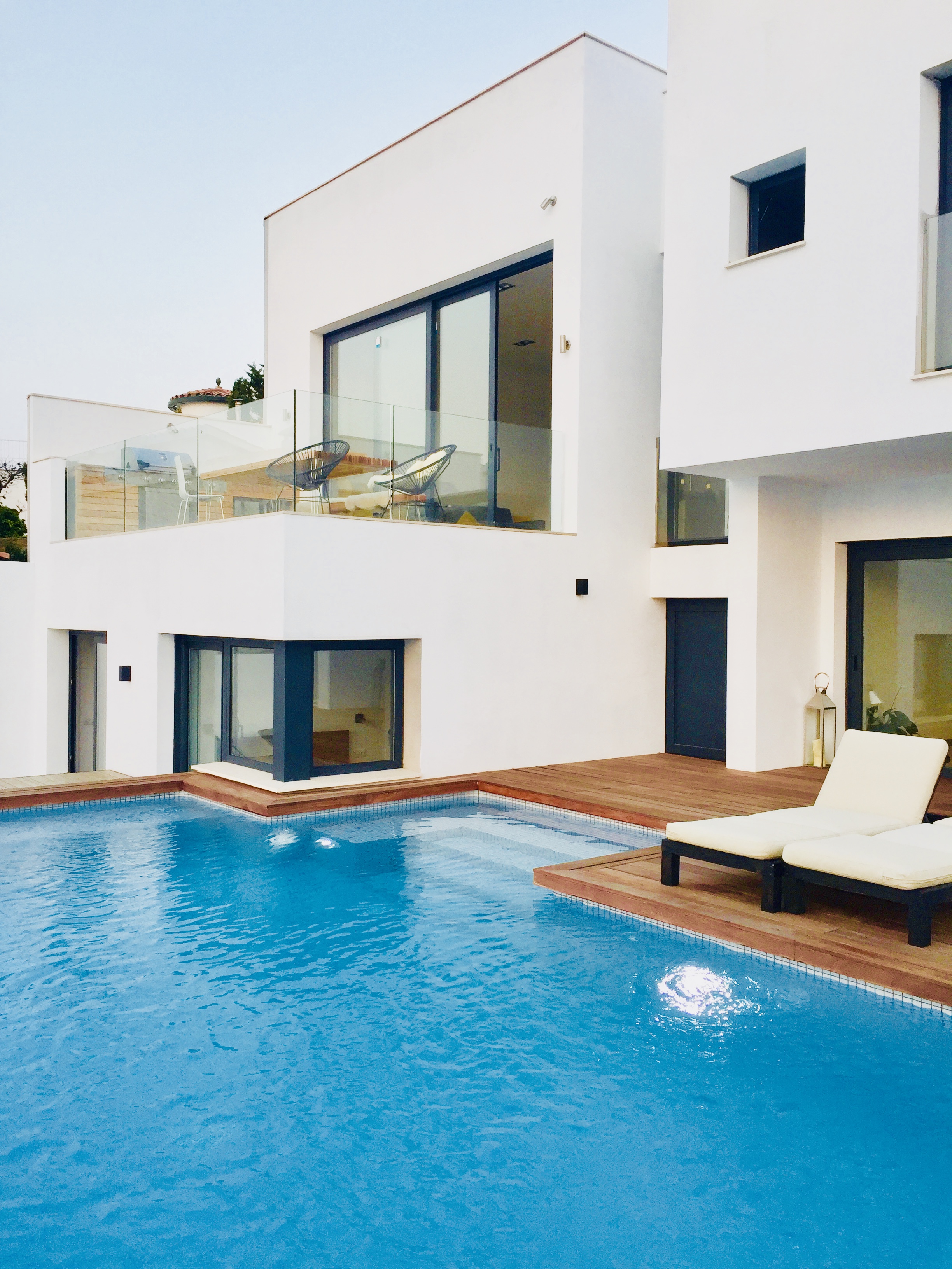 Casa23 villa exterior with pool and sun loungers